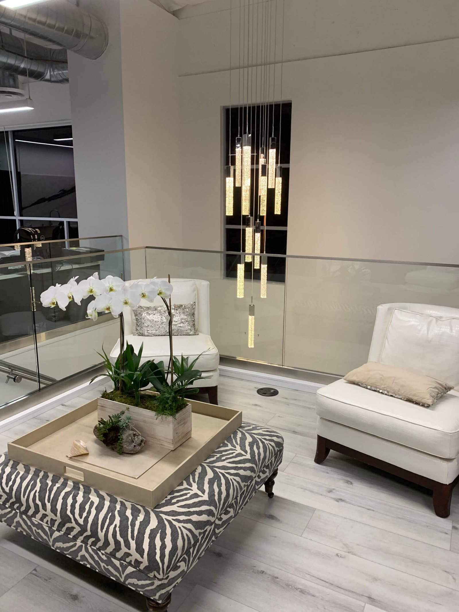 Office lounge build-out with pendant lighting