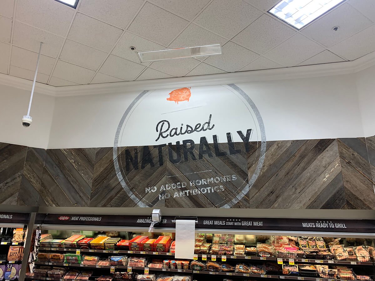 Market interior fit-out with reclaimed wood wall